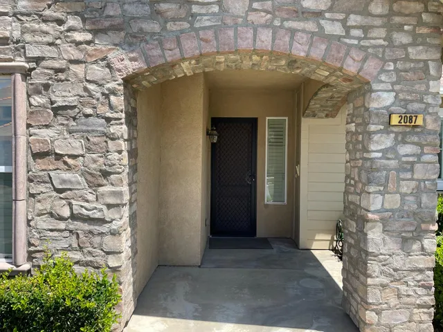 a view of a wooden door of the house