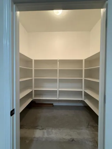 a view of a big house with a big yard and palm trees