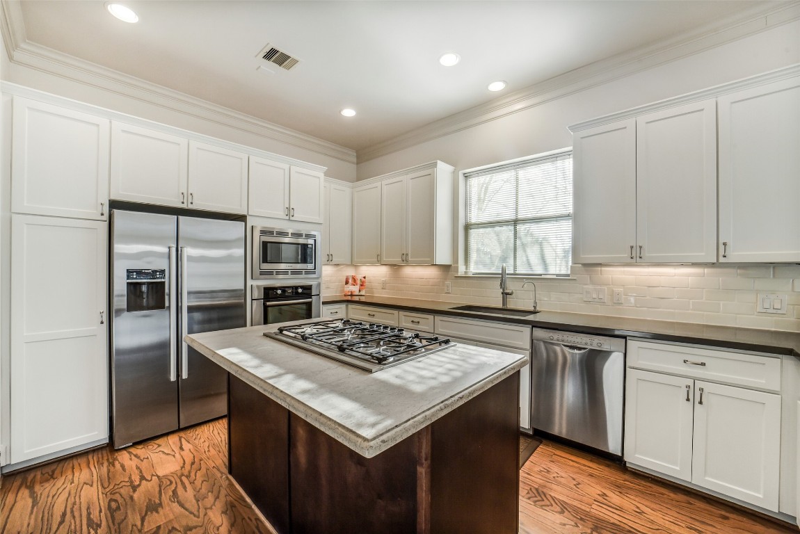 15943 Morgan Street Sugar Land, TX 77478 - Photo 13 of 41 a kitchen with a stove sink and refrigerator