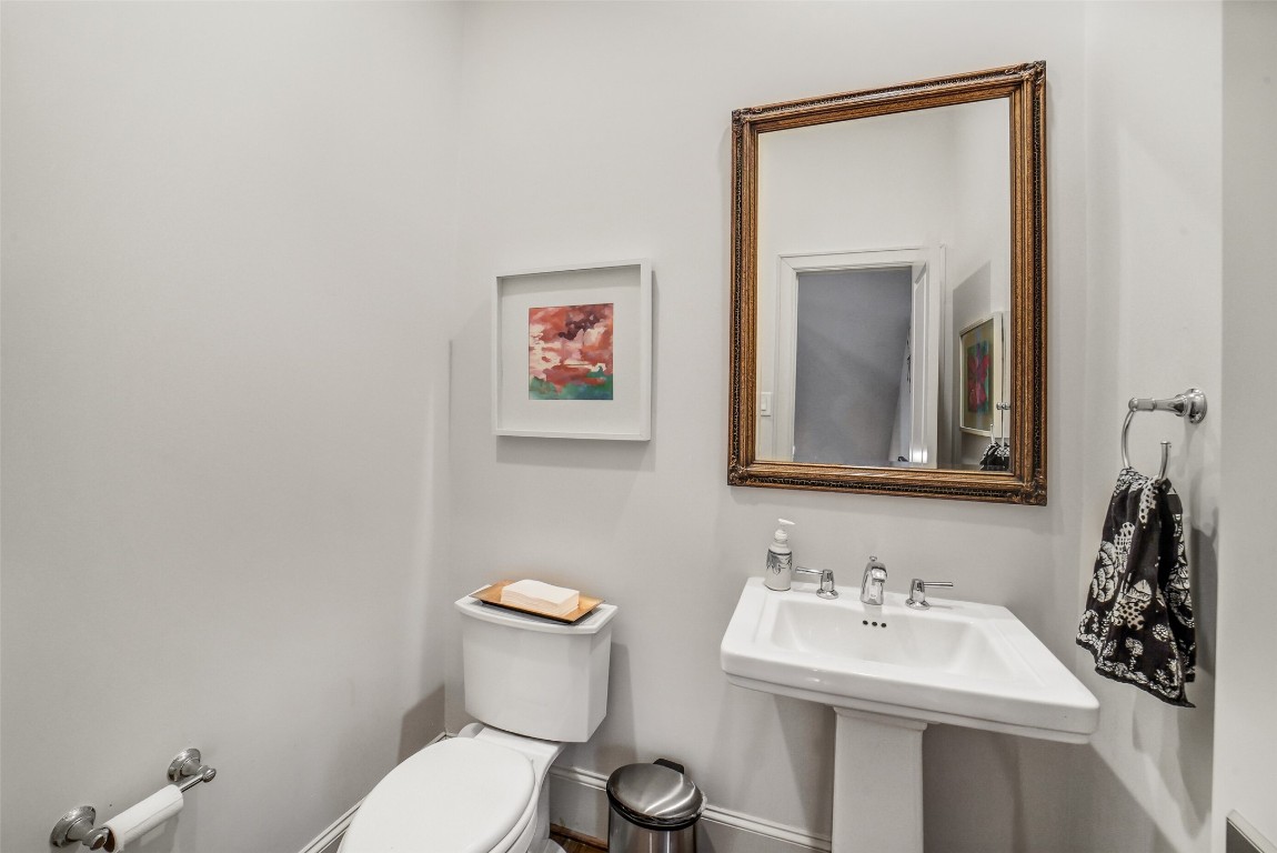 15943 Morgan Street Sugar Land, TX 77478 - Photo 19 of 41 a bathroom with a toilet sink and mirror