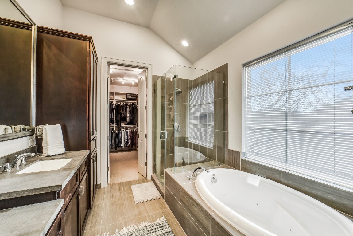 15943 Morgan Street Sugar Land, TX 77478 - Photo 24 of 41 a bathroom with a tub sink shower and mirror