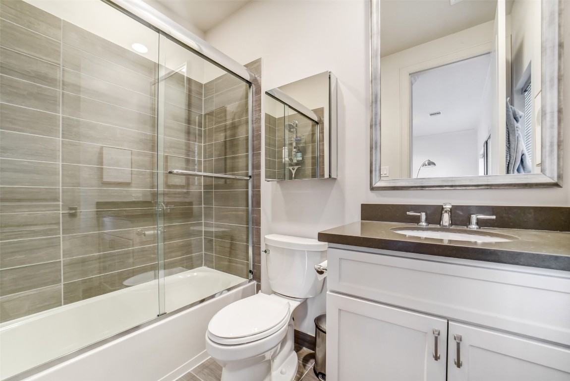 15943 Morgan Street Sugar Land, TX 77478 - Photo 30 of 41 a bathroom with a sink a toilet and shower