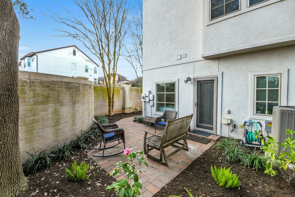 15943 Morgan Street Sugar Land, TX 77478 - Photo 32 of 41 a building outdoor space with patio couch and potted plants