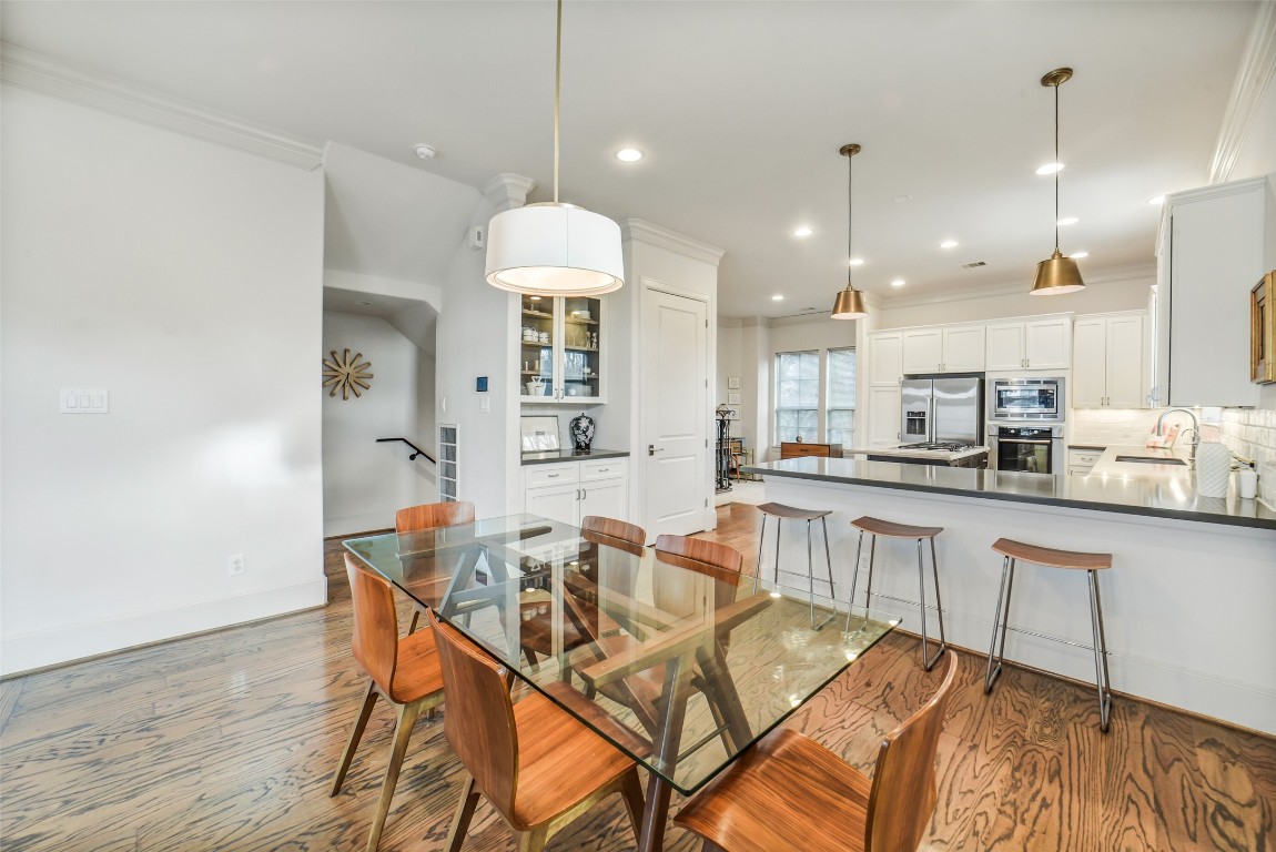 15943 Morgan Street Sugar Land, TX 77478 - Photo 10 of 41 a view of a dining room with furniture and wooden floor