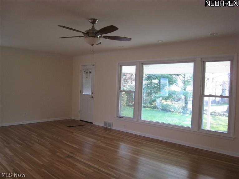 1092 Blanchester Road Lyndhurst, OH 44124 - Photo 7 of 12 Living room with picture window overlooking backyard