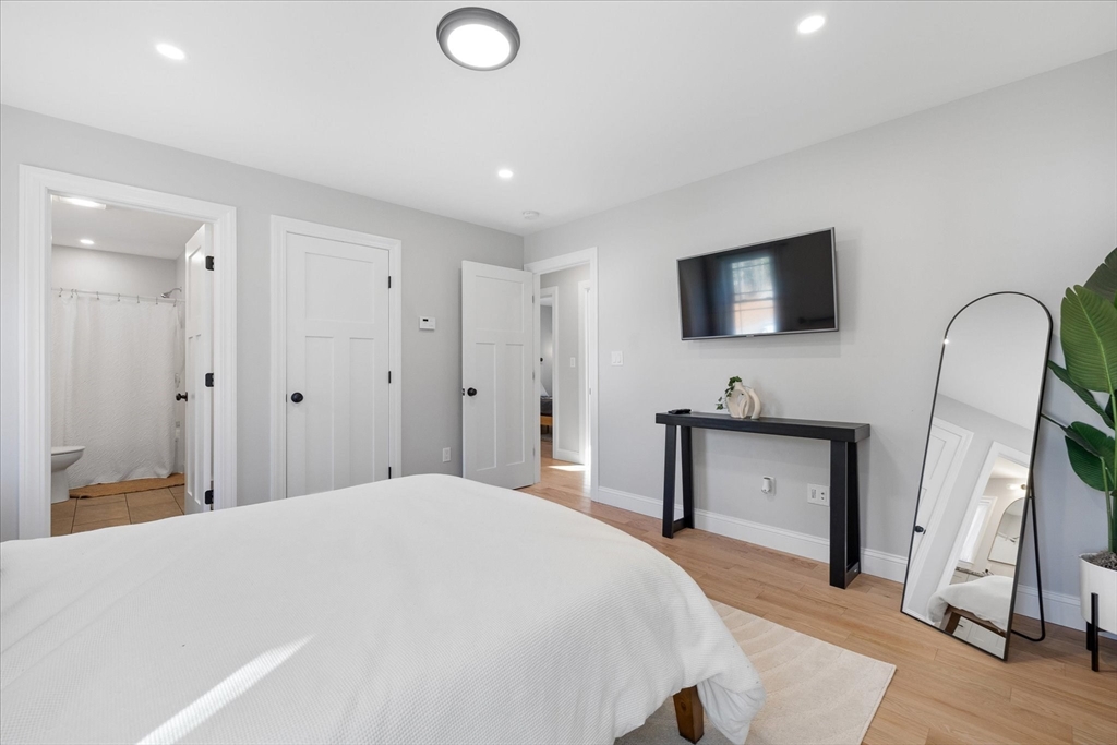 245 Brookside Road Athol, MA 01331 - Photo 13 of 27 a bedroom with a bed and a flat screen tv