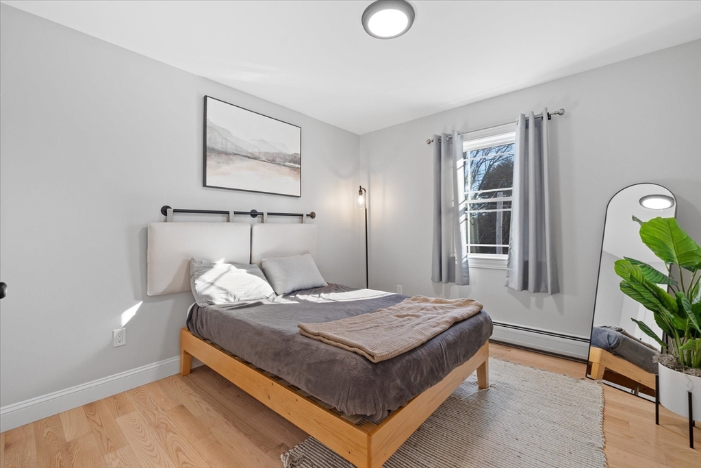 245 Brookside Road Athol, MA 01331 - Photo 16 of 27 a bedroom with a bed and wooden floor