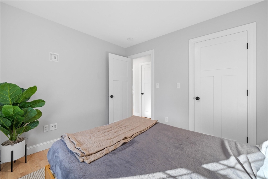 245 Brookside Road Athol, MA 01331 - Photo 17 of 27 a bedroom with a bed and a potted plant