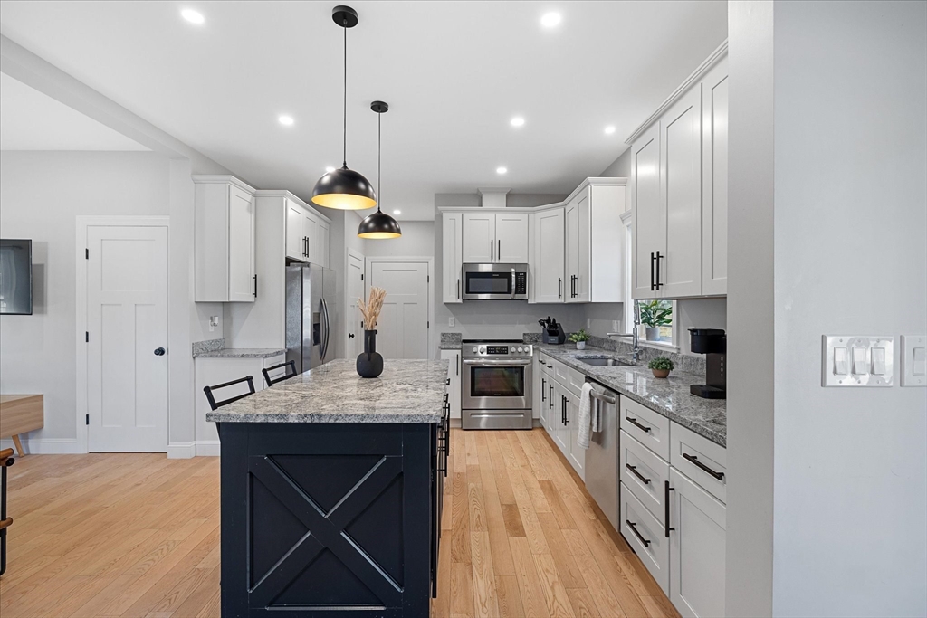 245 Brookside Road Athol, MA 01331 - Photo 4 of 27 a kitchen with kitchen island granite countertop a sink cabinets and stainless steel appliances