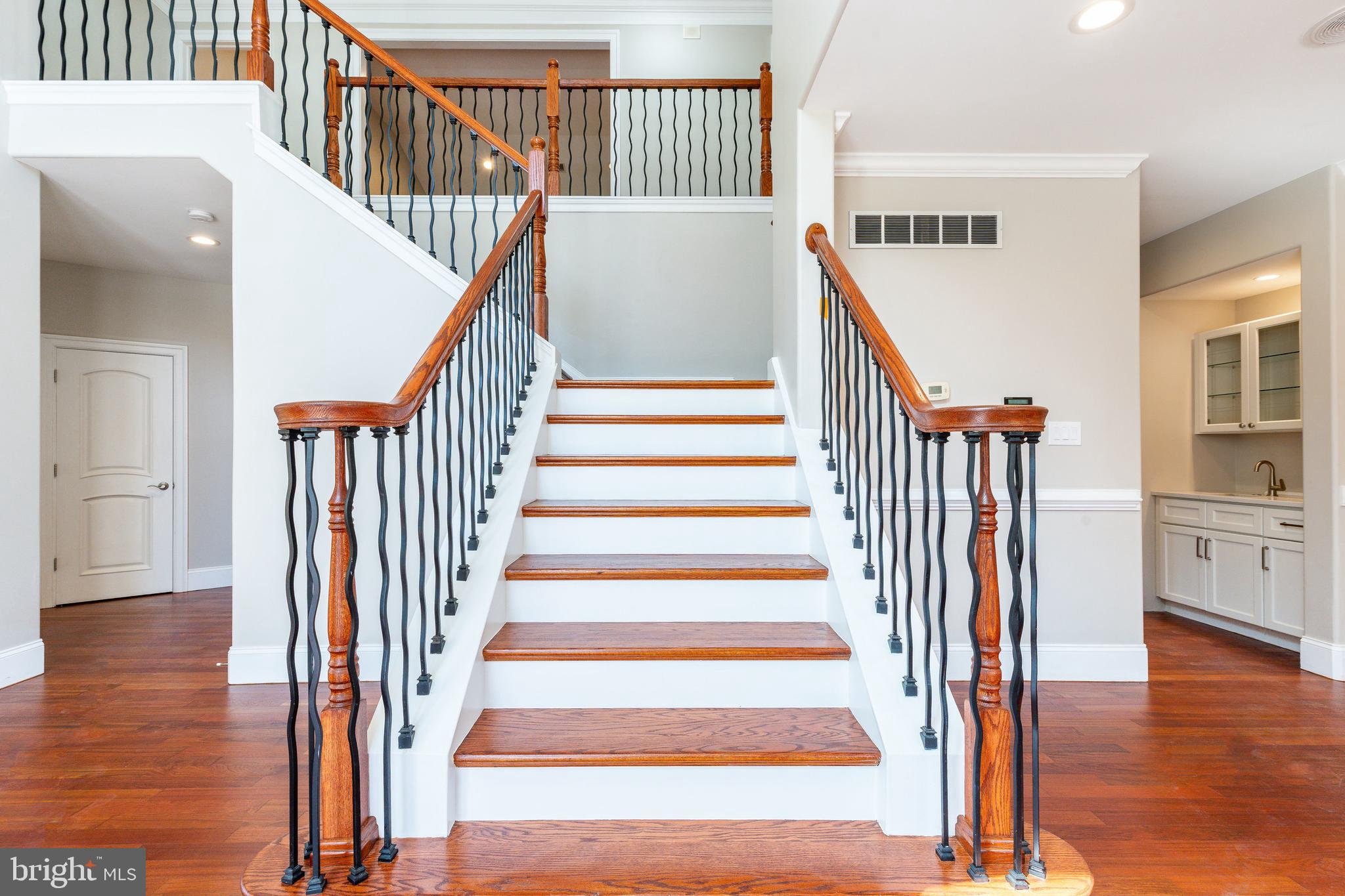 1060 Welsh Road Philadelphia, PA 19115 - Photo 1 of 62 a view of staircase with wooden floor and a chandelier