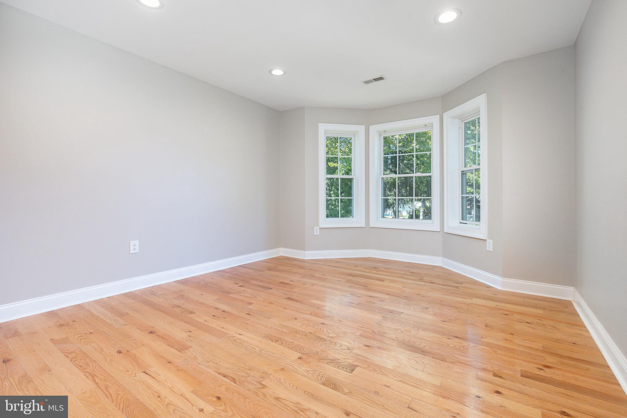 1060 Welsh Road Philadelphia, PA 19115 - Photo 19 of 62 a view of an empty room with wooden floor and a window