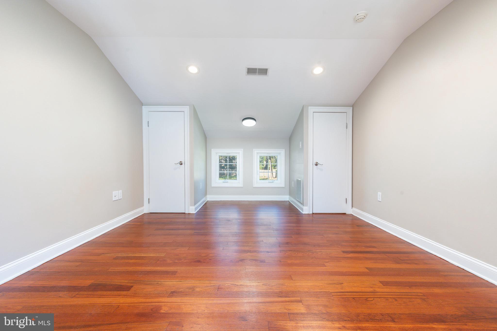 1060 Welsh Road Philadelphia, PA 19115 - Photo 23 of 62 a view of empty room with wooden floor and windows