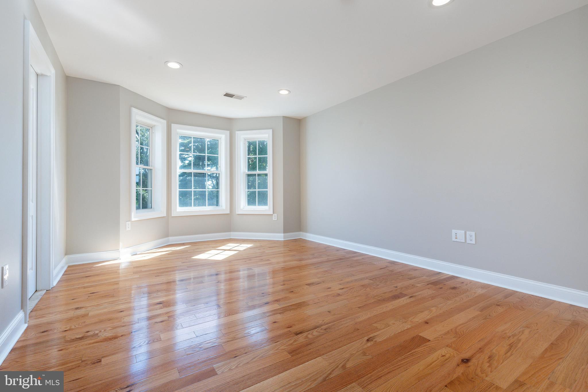 1060 Welsh Road Philadelphia, PA 19115 - Photo 25 of 62 a view of an empty room with wooden floor and a window