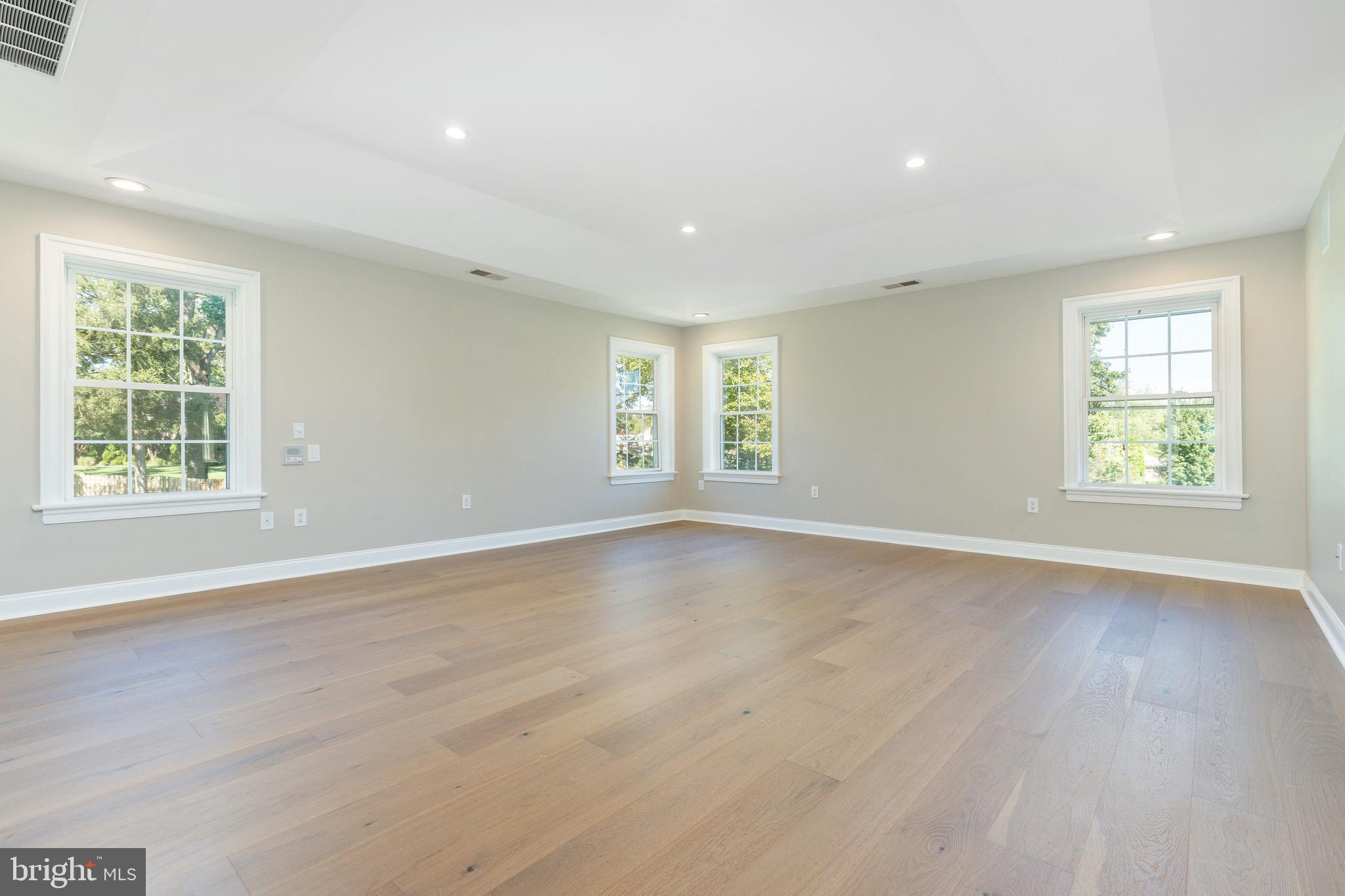 1060 Welsh Road Philadelphia, PA 19115 - Photo 29 of 62 an empty room with wooden floor and windows
