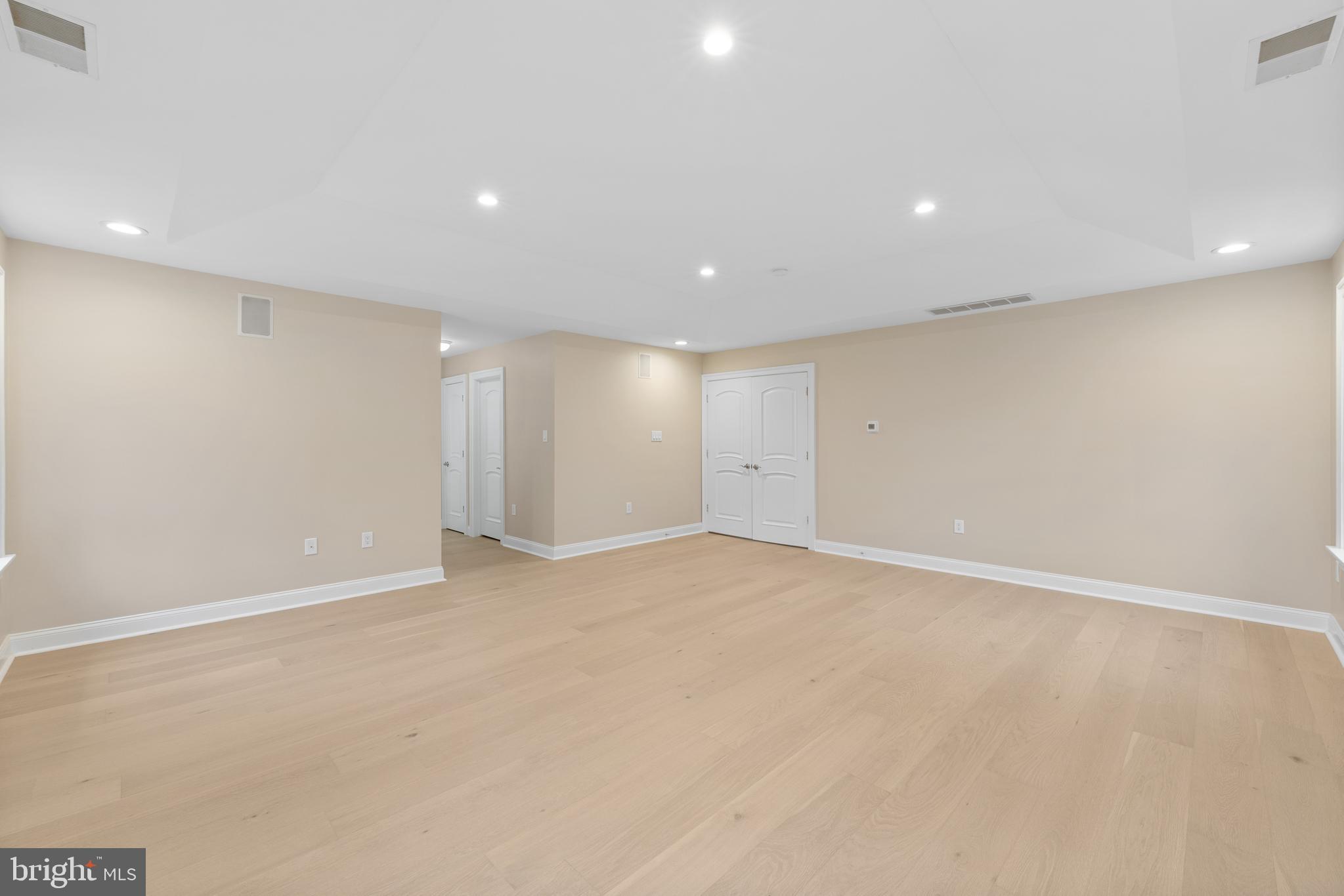 1060 Welsh Road Philadelphia, PA 19115 - Photo 30 of 62 an empty room with wooden floor and natural light