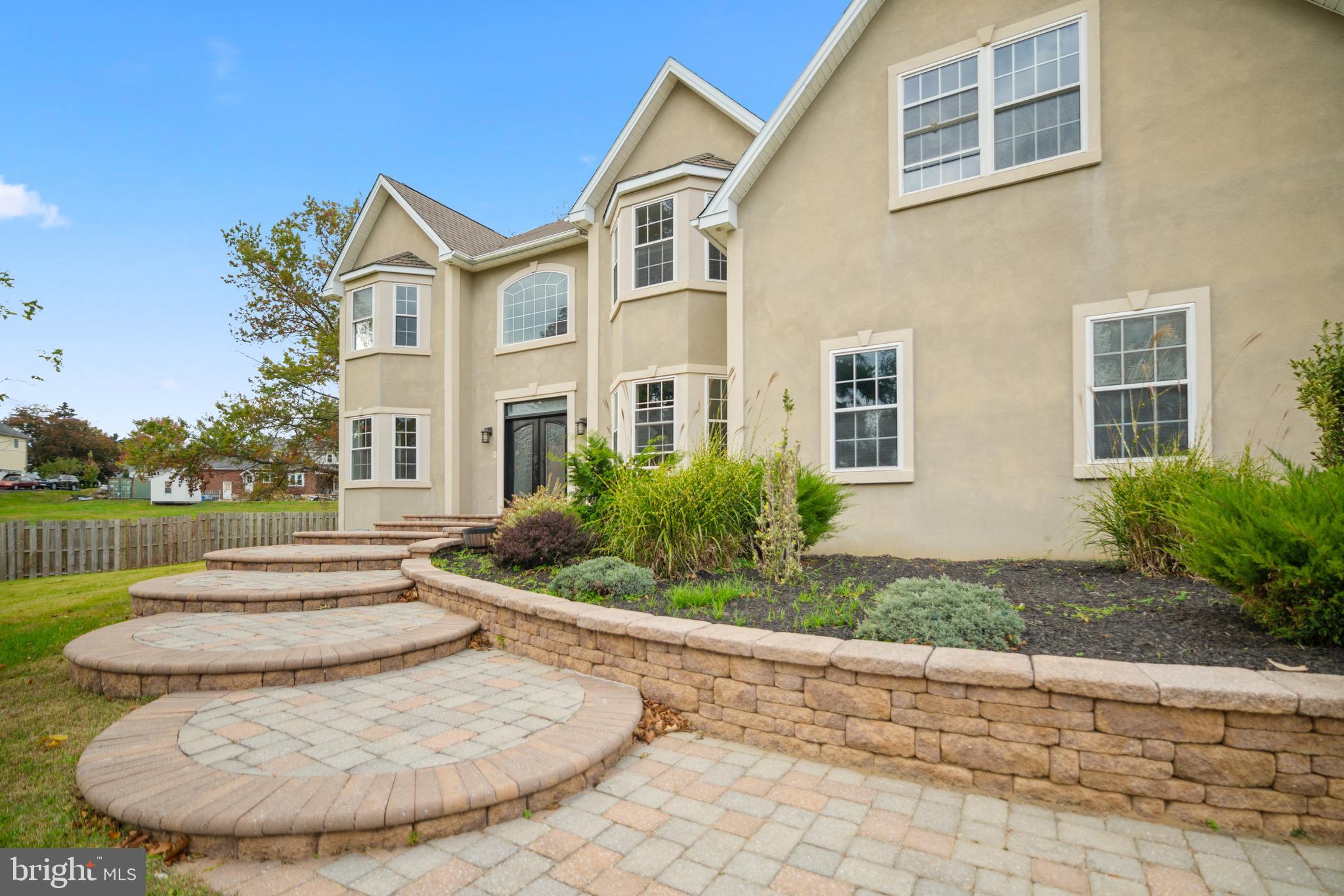 1060 Welsh Road Philadelphia, PA 19115 - Photo 3 of 62 a view of a white building among the street with palm trees