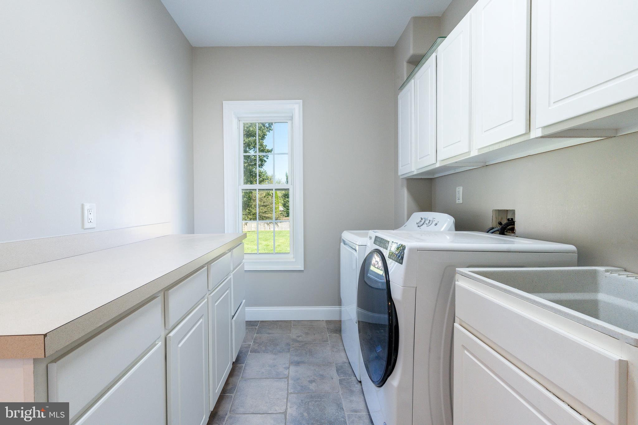1060 Welsh Road Philadelphia, PA 19115 - Photo 40 of 62 a utility room with dryer and washer