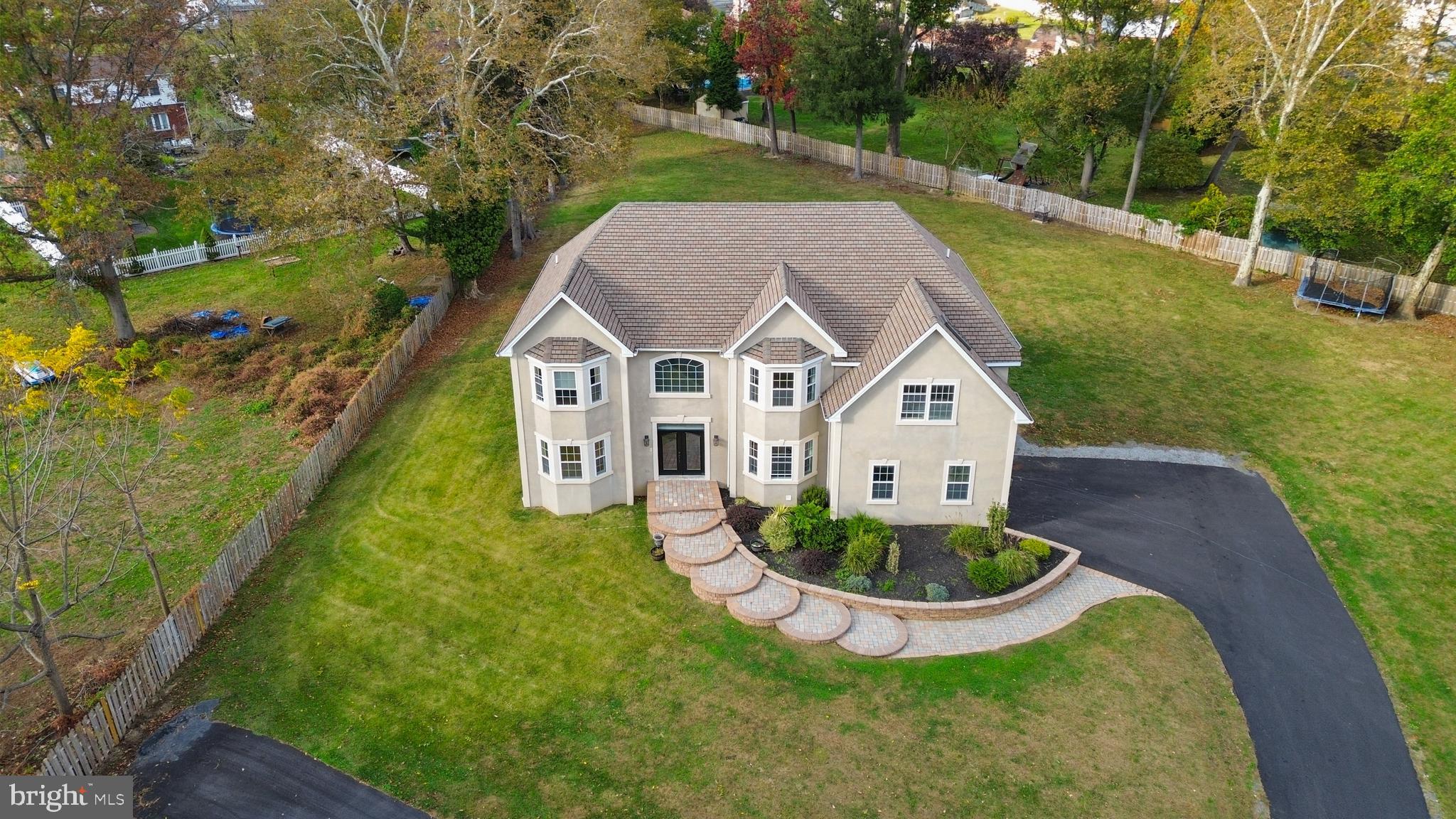 1060 Welsh Road Philadelphia, PA 19115 - Photo 54 of 62 a aerial view of a house with a yard table and chairs