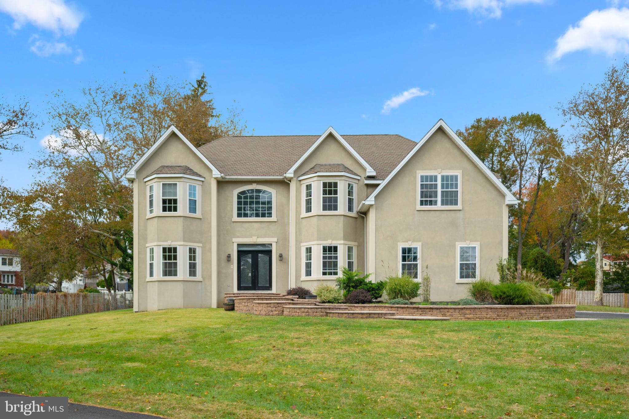1060 Welsh Road Philadelphia, PA 19115 - Photo 58 of 62 a front view of a house with a garden and yard