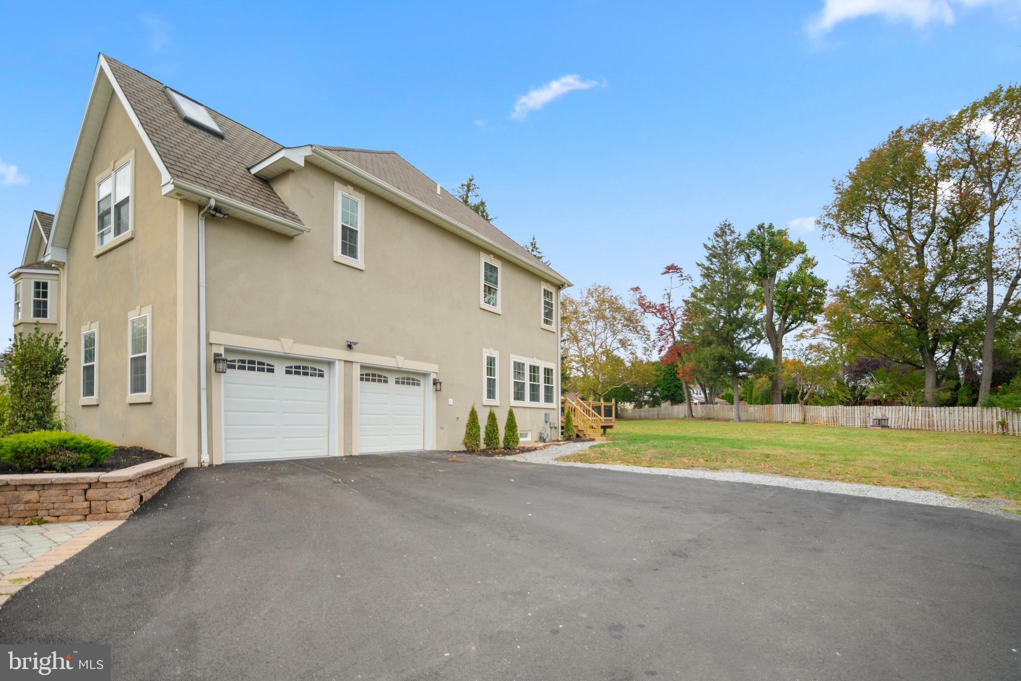 1060 Welsh Road Philadelphia, PA 19115 - Photo 60 of 62 a view of a house with a big yard and palm trees