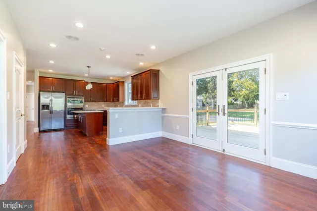 a view of kitchen with wooden floor