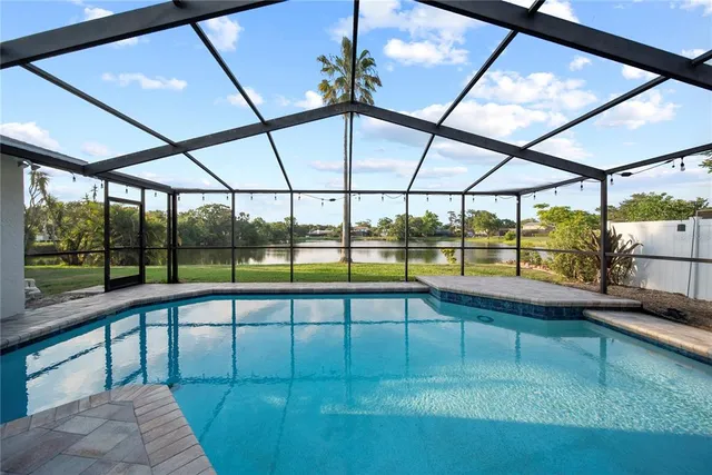 a view of a swimming pool with a porch