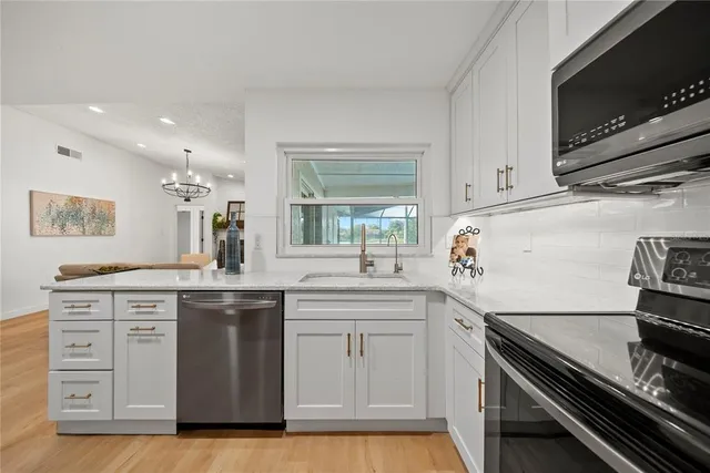 a kitchen with a stove and a microwave