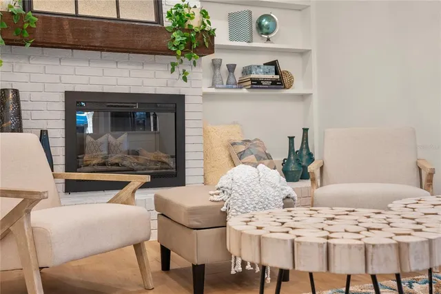 a dining room with furniture and a fireplace