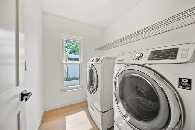 a utility room with dryer and washer