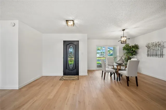 a view of a livingroom with furniture window and wooden floor