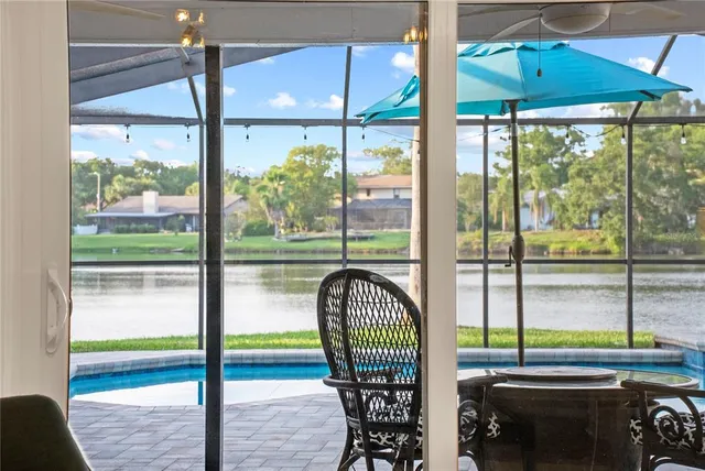 a view of a dining room with furniture window and outside view