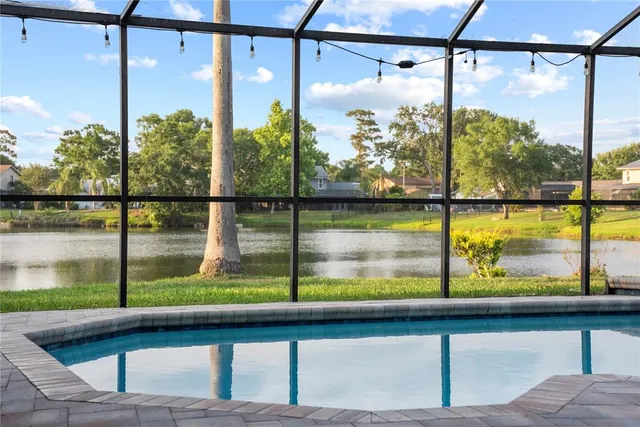 an aerial view of residential houses with city view