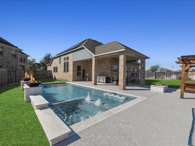 a view of a house with a yard porch and sitting area