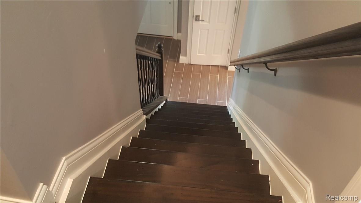 25555 Meridian Road Grosse Ile, MI 48138 - Photo 40 of 58 From upstairs looking toward coat closet and front door.