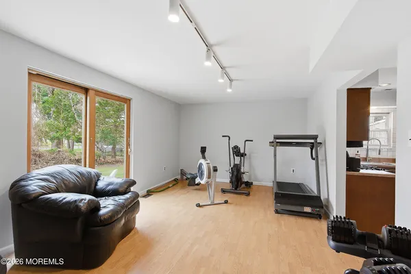 a livingroom with furniture and a large window