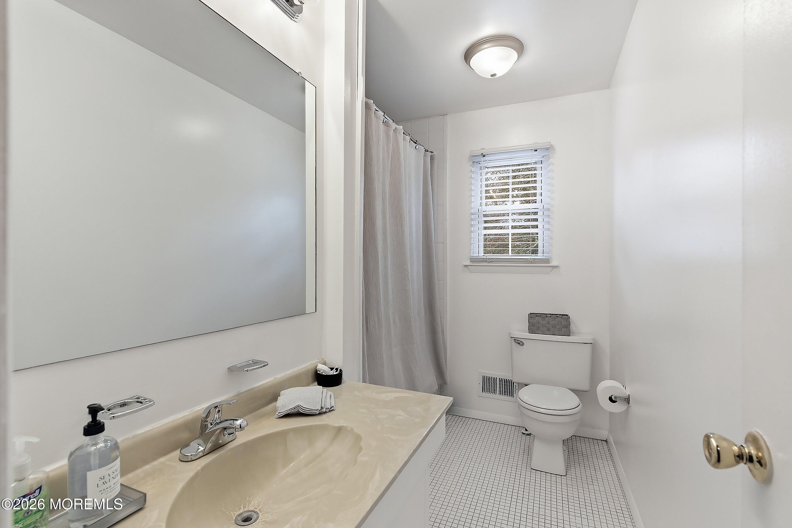 9 Bell Court Howell, NJ 07731 - Photo 21 of 30 a bathroom with a sink toilet and shower