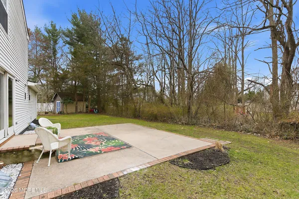 a view of backyard with tree