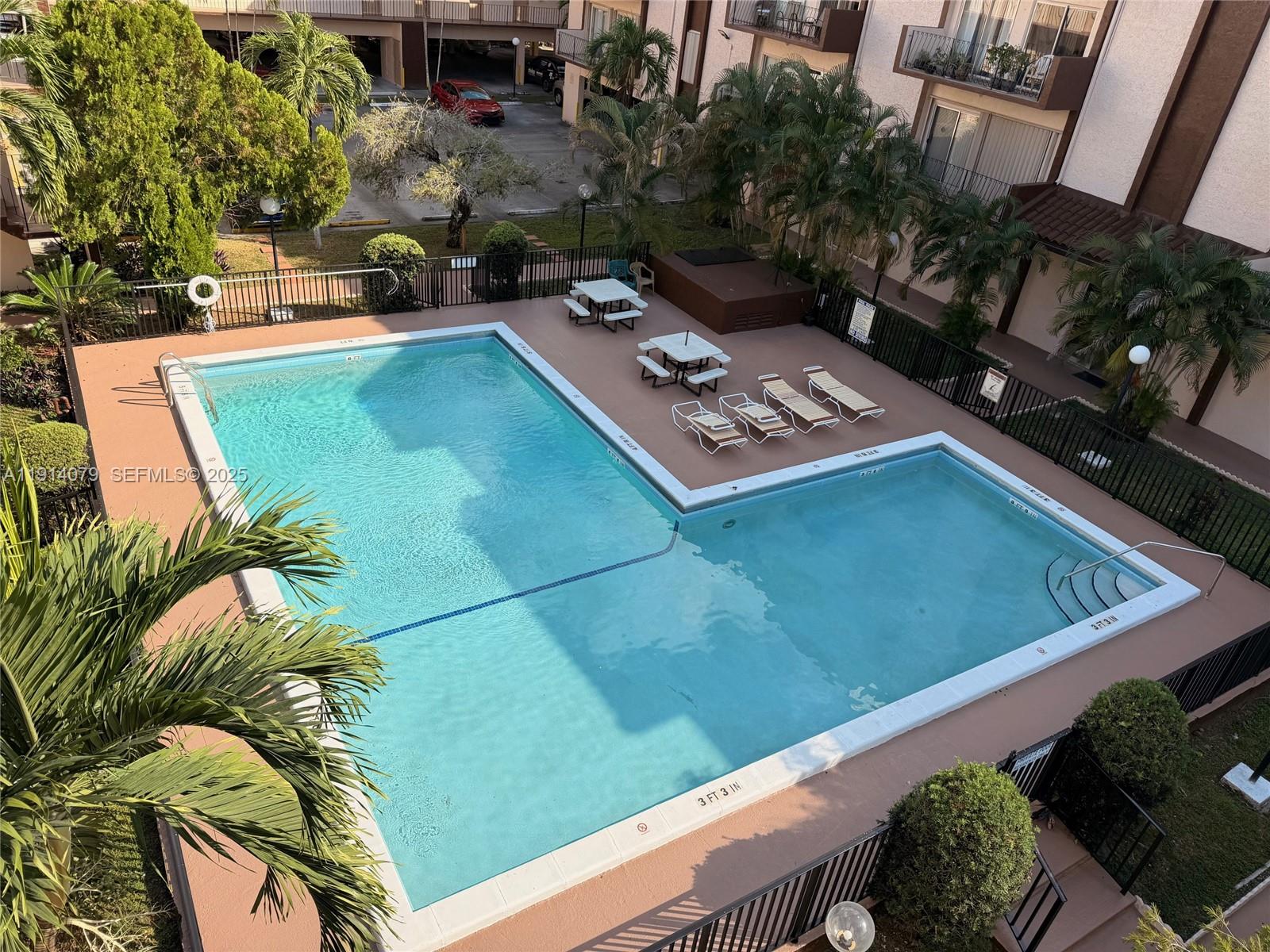 a view of a chairs and table in patio