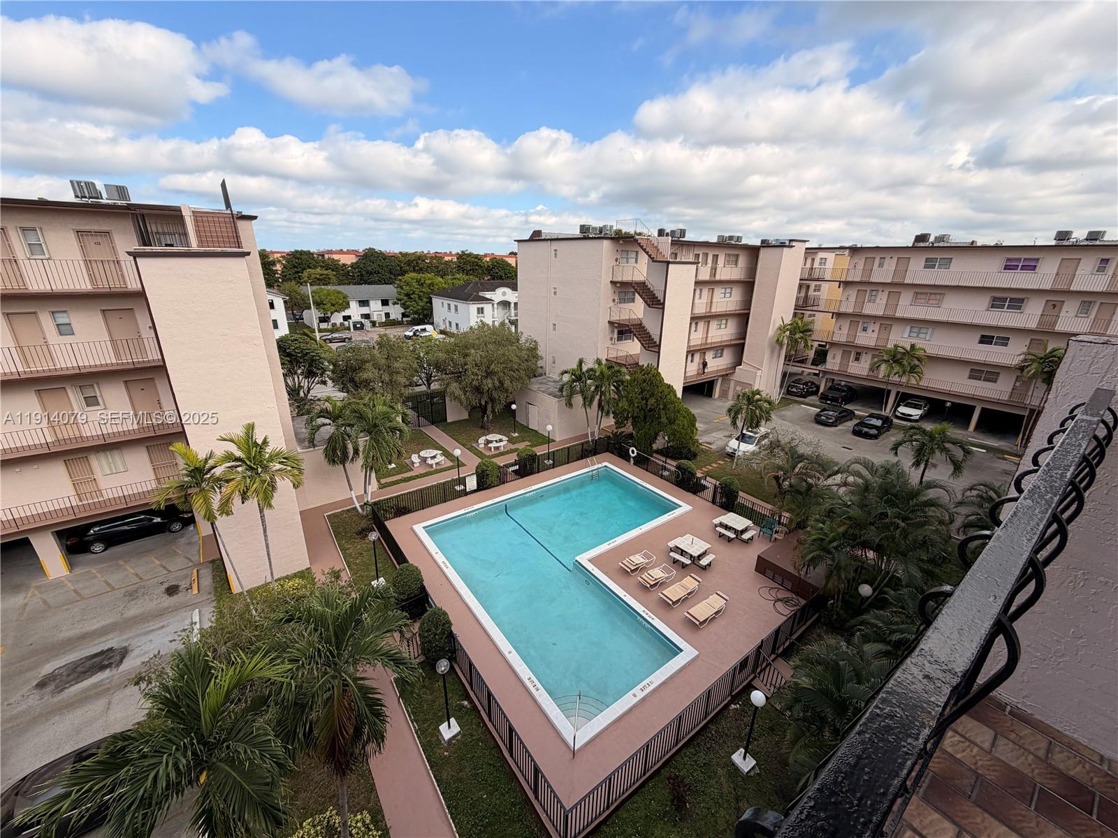 1950 West 54th Street, Unit 413 Hialeah, FL 33012 - Photo 15 of 15 a view of a balcony with chairs