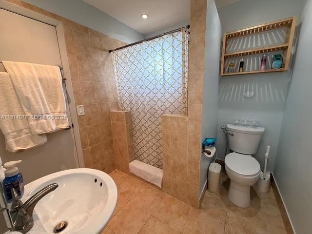 1950 West 54th Street, Unit 413 Hialeah, FL 33012 - Photo 9 of 15 a bathroom with a toilet and a sink