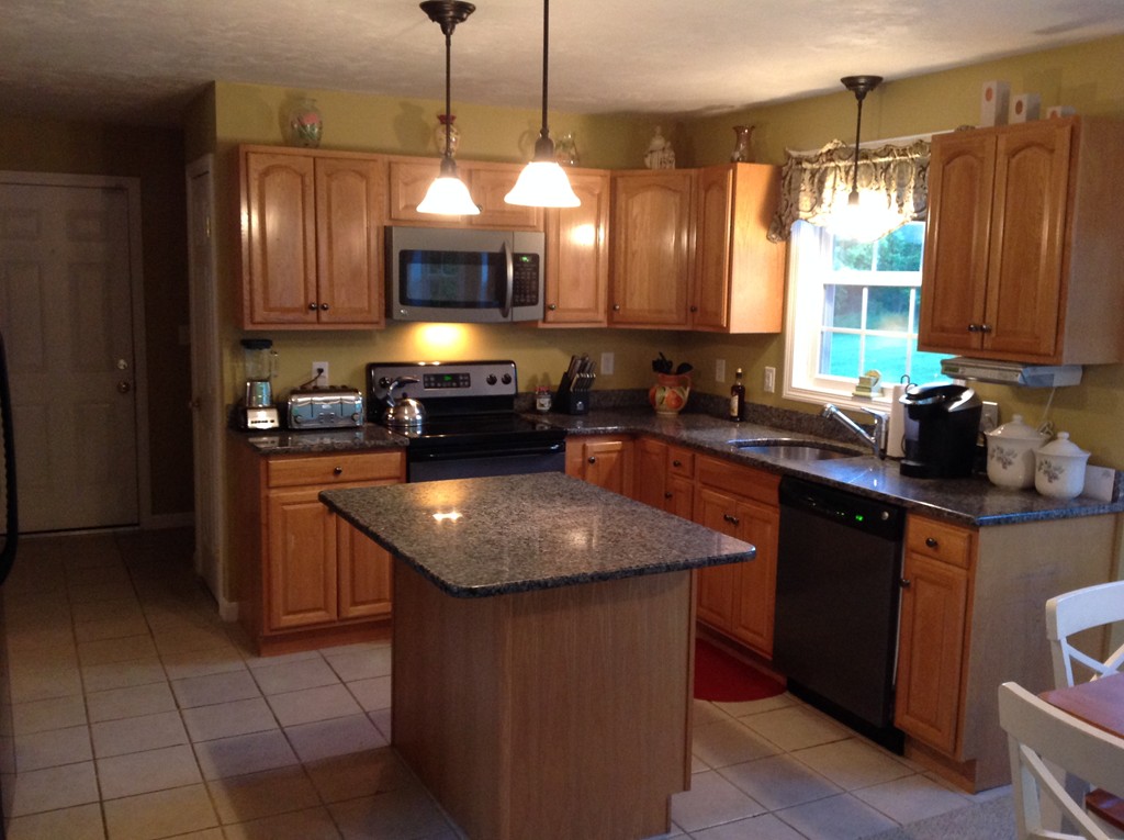 44 Tobin Road Leicester, MA 01611 - Photo 14 of 30 a kitchen with stainless steel appliances granite countertop a sink a stove a oven a counter space and cabinets