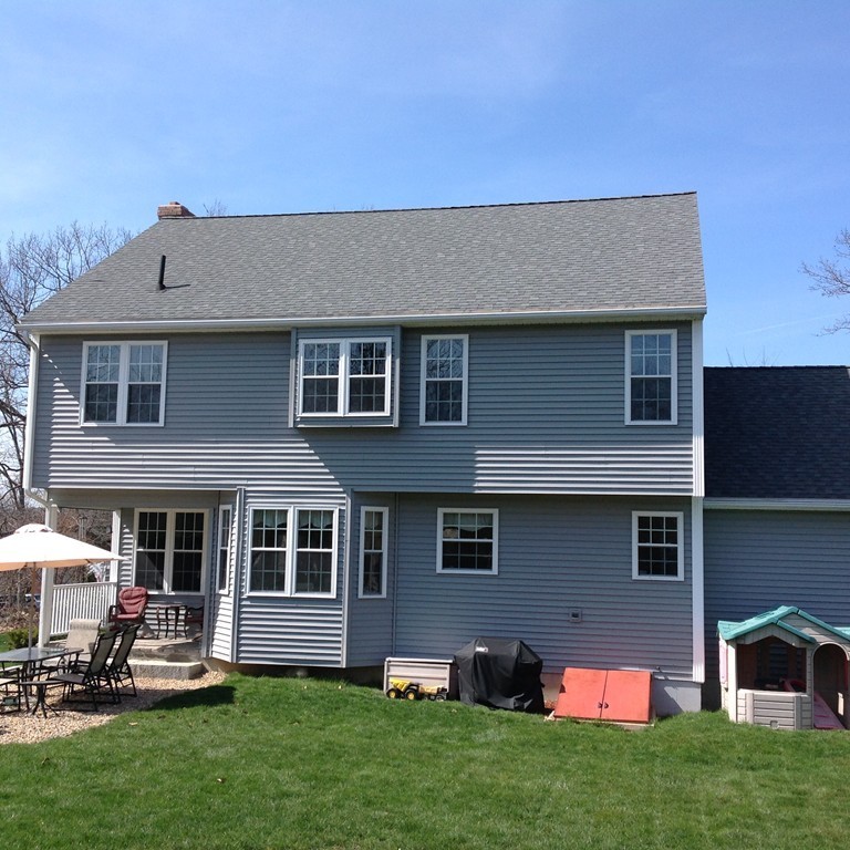 44 Tobin Road Leicester, MA 01611 - Photo 2 of 30 a backyard of a house with table and chairs