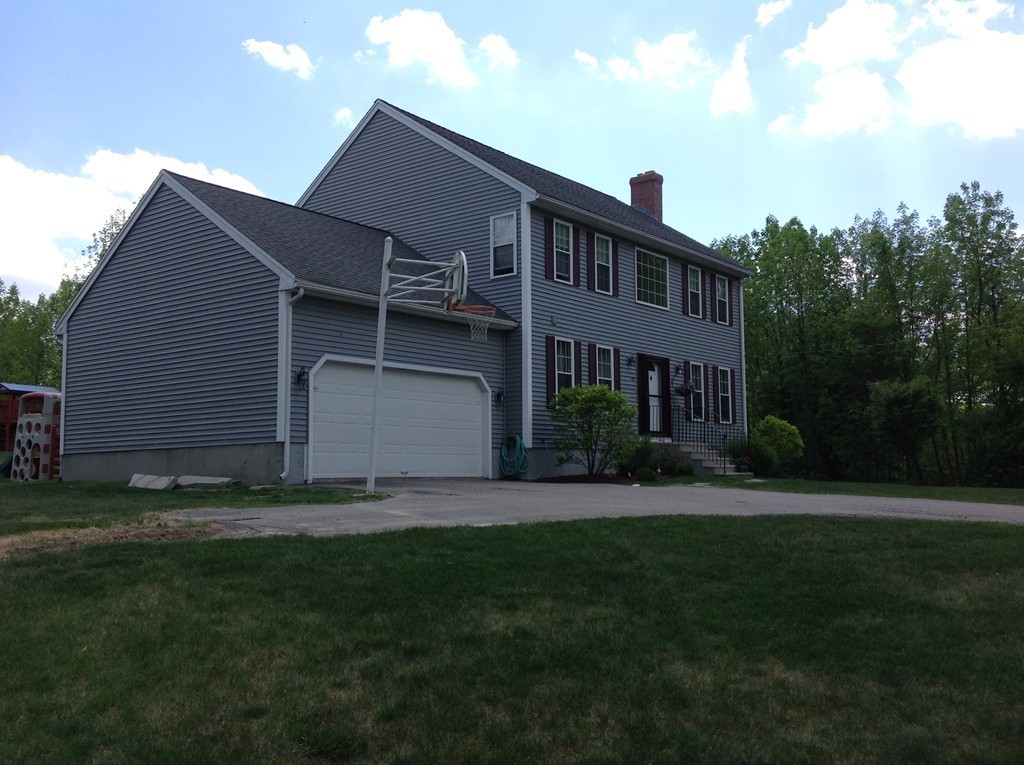 44 Tobin Road Leicester, MA 01611 - Photo 3 of 30 a front view of a house with a garden