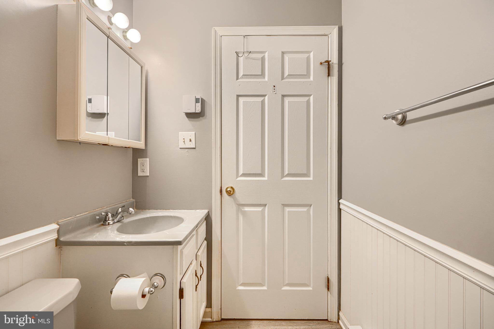 708 Gray Mt Circle Elkton, MD 21921 - Photo 32 of 59 a bathroom with a granite countertop sink and a mirror