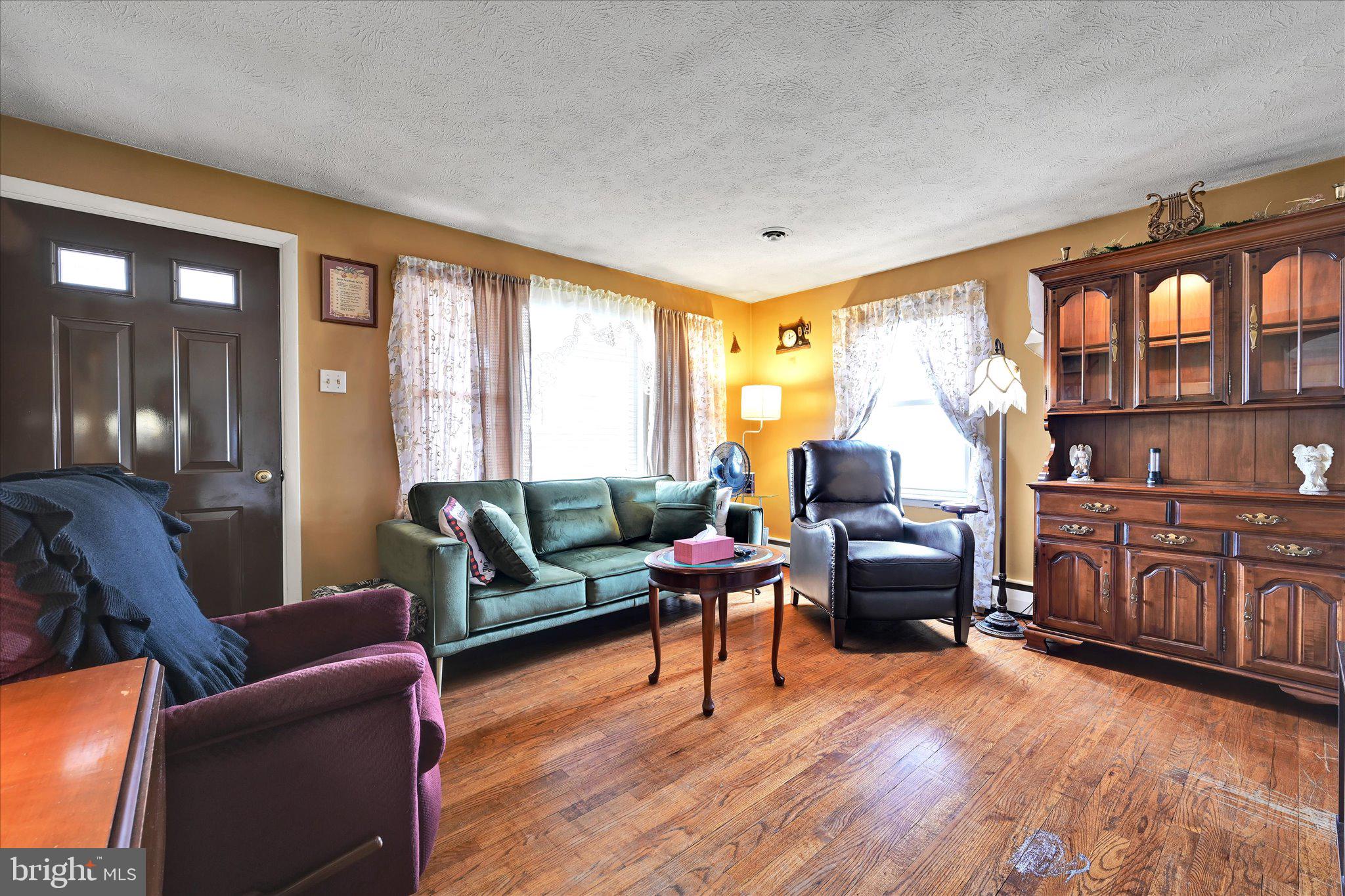 784 Ruth Street Sinking Spring, PA 19608 - Photo 9 of 27 a living room with furniture and a wooden floor