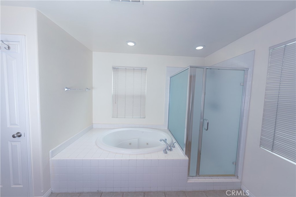 3663 Scribner Lane Inglewood, CA 90305 - Photo 10 of 18 a bathroom with a bathtub and a shower