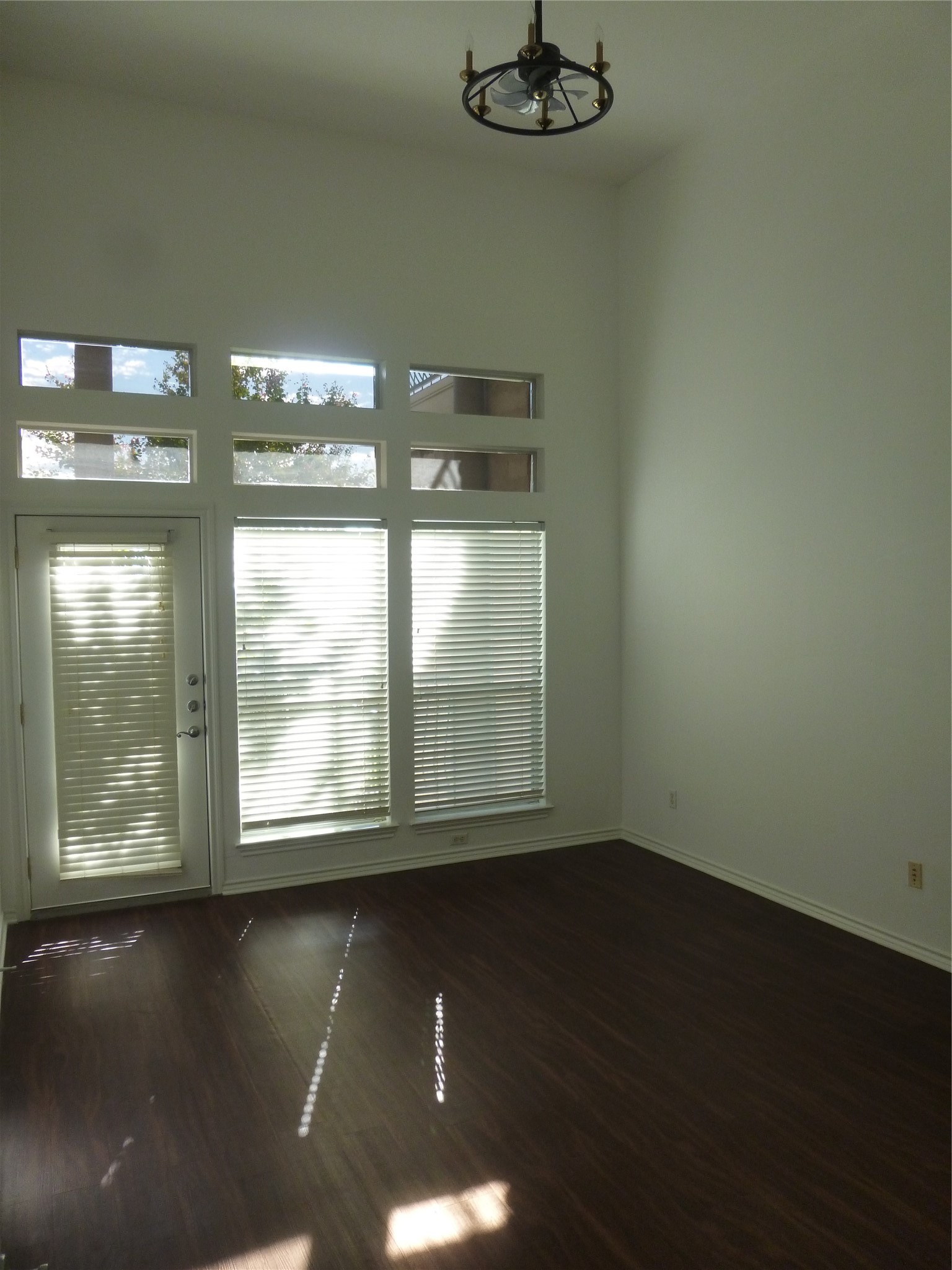 2918 Ranch Road 620 North, Unit Y194 Austin, TX 78734 - Photo 15 of 35 a view of an empty room with wooden floor and a window