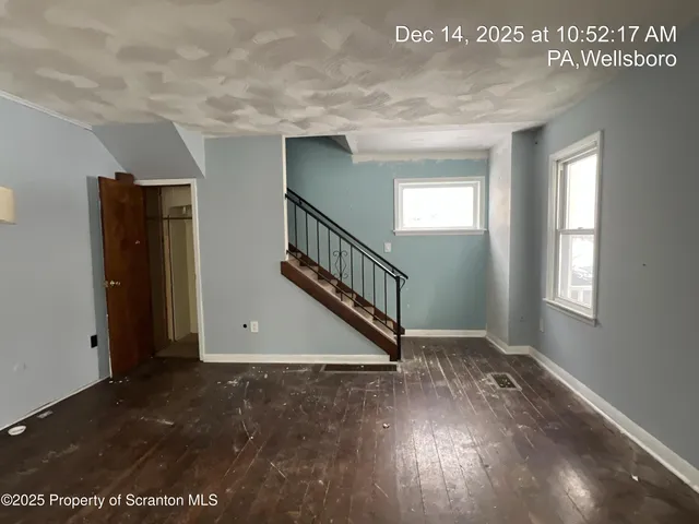 an entryway in a hall with a window