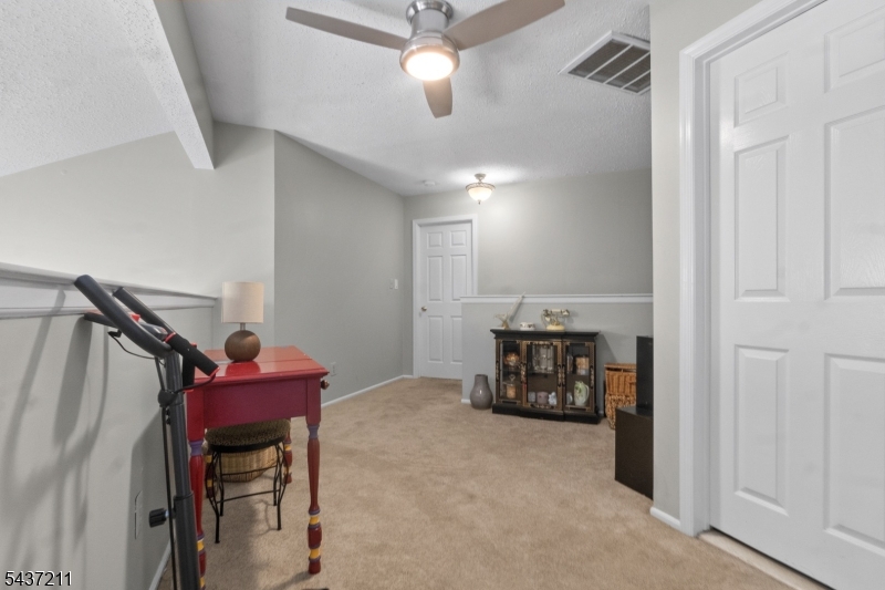 3701 Park Place Springfield, NJ 07081 - Photo 23 of 38 a view of a livingroom with furniture and a ceiling fan