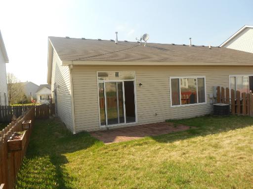 357 Reston Circle, Unit 1 Romeoville, IL 60446 - Photo 3 of 5 a view of a house with backyard and porch